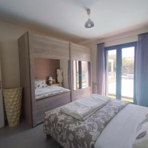 Ένα ή περισσότερα κρεβάτια σε δωμάτιο στο Villa Félines