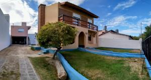 a villa with a view of a house at CASA AGUAS AZULES 6 pax LAS GRUTAS in Las Grutas