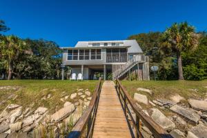 a house on the beach with a wooden walkway at Gone Fishin' in Edisto Island