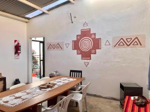 a dining room with a table and chairs at Renacer en Salta in Salta