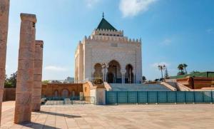 a large building with a tower with a roof at Dar Lala Fatima Zahrae in Rabat