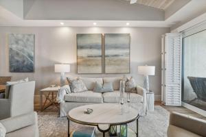 a living room with a couch and a table at HP 45W What the Heck by 30A Escapes in Rosemary Beach