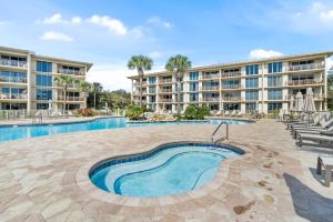 a resort with a swimming pool and a building at HP 45W What the Heck by 30A Escapes in Rosemary Beach