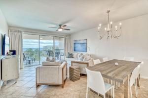 a dining room and living room with a table and chairs at HP 422 Blue Haven by 30A Escapes in Rosemary Beach +32 photos
