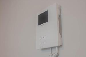 a nintendo wii game system on a white wall at Stylish Studio Apartment in Southampton