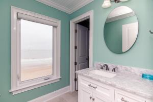 a bathroom with a sink and a mirror at Hannah's Choice in Edisto Island +54 photos