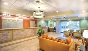 a lobby of a hospital with chairs and a waiting room at Club Wyndham at Majestic Sun in Destin +47 photos