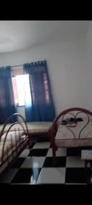 Ένα ή περισσότερα κρεβάτια σε δωμάτιο στο Residência dos guimaraes