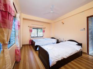 Katil atau katil-katil dalam bilik di Hotel Sunflower
