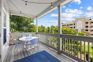 a patio with a table and chairs on a deck at Hidden Gem #6 by 30A Escapes in Seacrest
