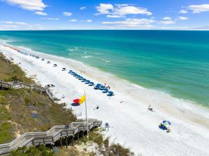 an overhead view of a beach with umbrellas and the ocean at Happy Hour on 30A #5 by 30A Escapes in Seacrest