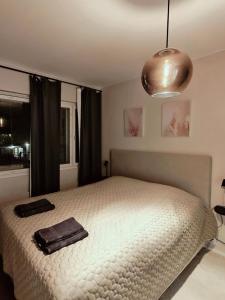 Ένα ή περισσότερα κρεβάτια σε δωμάτιο στο PirkkaNest