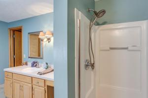 a bathroom with a sink and a white door at Work and Relax! Spacious Ontario Home with Pool in Mansfield +32 photos