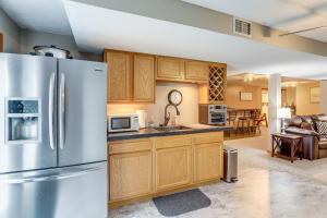 a kitchen with a stainless steel refrigerator at Work and Relax! Spacious Ontario Home with Pool in Mansfield