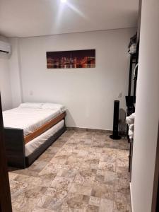 Ένα ή περισσότερα κρεβάτια σε δωμάτιο στο Colombia Escape - Rodadero Extasis +14 φωτογραφίες