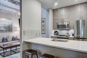 a kitchen with a sink and a microwave at Parker's Collection Unit 7 in Savannah