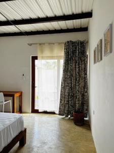 a bedroom with a bed and a large window at Buena Vista in El Paredón Buena Vista