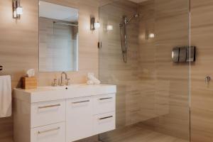 a bathroom with a sink and a shower at Haven on James in Bicheno +19 photos