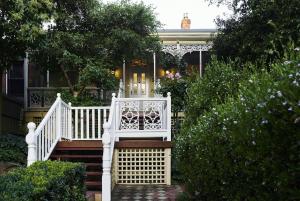 a white staircase leading to a house at Bendigo Signature Accommodation Wattle Street in Bendigo