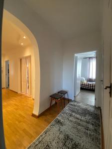 an empty hallway with a table and a rug at 3-badroom flat near the sea with 12 places to sleep in Sychavka