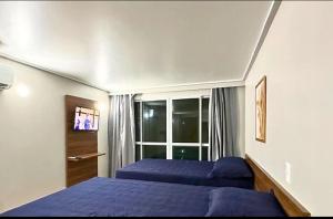 Postel nebo postele na pokoji v ubytování Flats Cabo Branco