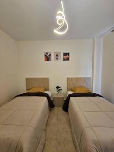 Postel nebo postele na pokoji v ubytování Petra Gate Apartment