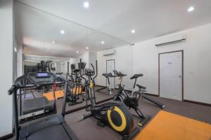 a gym with several treadmills and exercise bikes at Condo 1BR Naiharn Beach by IBG Property P204 in Phuket Town