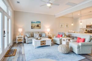 a living room with two couches and a table at 519 The Great Neck House in Virginia Beach