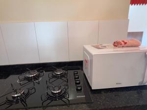 O bucătărie sau chicinetă la Chalé Sophia +6 fotografii