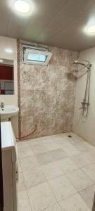 a bathroom with a shower and a sink at full moon in Yerevan