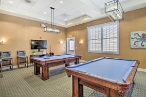 een kamer met een pooltafel en een tv bij Game Room and Patio Spacious Ocean View Home in Wilgus Subdivision