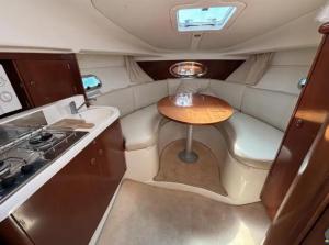 a small table in the back of a motor boat at Barco Marina de Cascais in Cascais