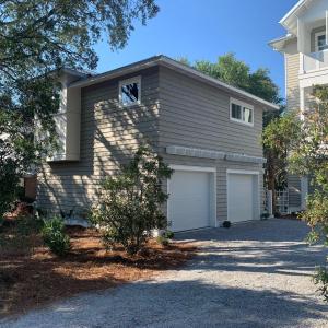 a house with two garages and a garage at Crystal Blue Persuasion in Santa Rosa Beach