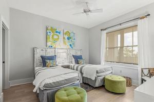 a bedroom with two beds and a window at Redfish Village - Beach-a-holic - M1-313 in Santa Rosa Beach +59 photos