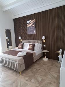 Postel nebo postele na pokoji v ubytování boutique teatro b&b