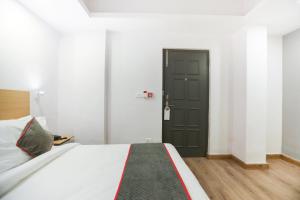 Photo de la galerie de l'établissement Super Townhouse Suncitel Near Kolkata Airport, à Kolkata 22 autres photos