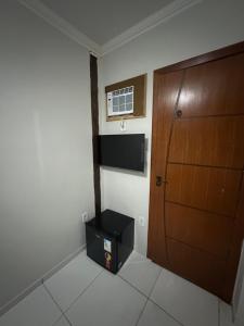 Μια τηλεόραση ή/και κέντρο ψυχαγωγίας στο Hospedagem do Centro