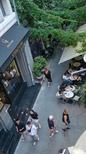 a group of people sitting at tables outside a restaurant at Zulu Suites in Istanbul