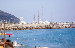 a group of people in the water at a beach at Casa Persi in Gorleri +24 photos