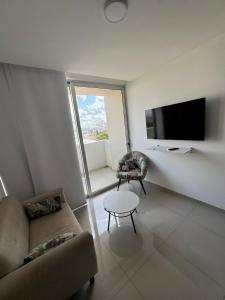 Televiisor ja/või meelelahutuskeskus majutusasutuses Departamento de 2 habitaciones en Av Las Americas