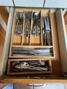 a drawer filled with silver utensils at Mountainside Retreat in Yucca Valley