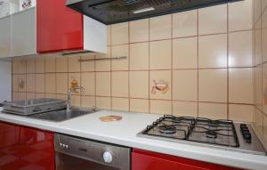 a kitchen with a sink and a stove top oven at Stunning Home In Comiso With Wifi in Comiso Airport