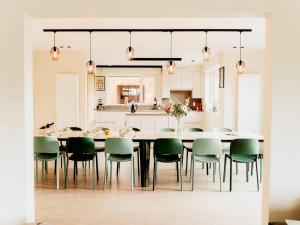 a kitchen and dining room with a large table and chairs at Luxury holiday home in Zwevezele in Lichtervelde
