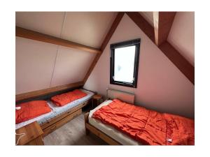 Ένα ή περισσότερα κρεβάτια σε δωμάτιο στο Ouddorp Grevelingen 60