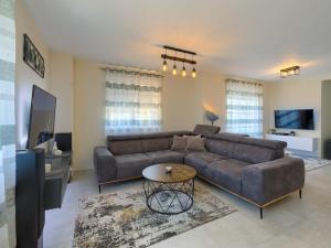 a living room with a couch and a table at Apartment Excellence in Pula
