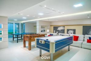 a living room with a pool table and ping pong ball at In Mare Bali Resort em Cotovelo by Qavi #239 in Granja Beira Mar
