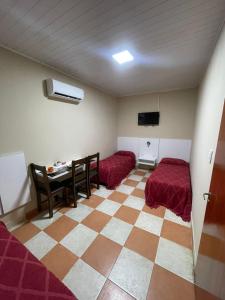 Ένα ή περισσότερα κρεβάτια σε δωμάτιο στο Hotel Don Luis