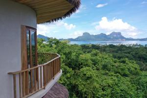 a balcony of a house with a view of the ocean at Atalaya Resort El Nido in El Nido