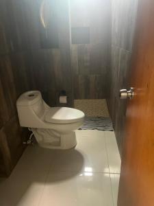a bathroom with a white toilet in a stall at Departamento 10 Polanco in Valladolid +7 photos