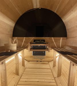 a small room with a large tv in a sauna at Tamagusuku Terrace in Nanjo +48 photos